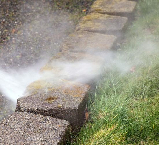 concrete yard features being cleaned by Six Shooter professional